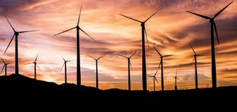 image of wind mills at sunset